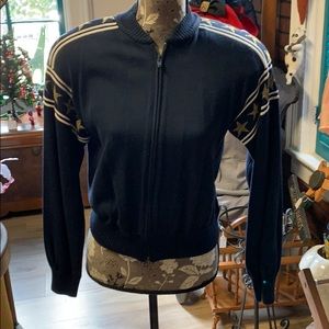 Blue sweater. Zip up front